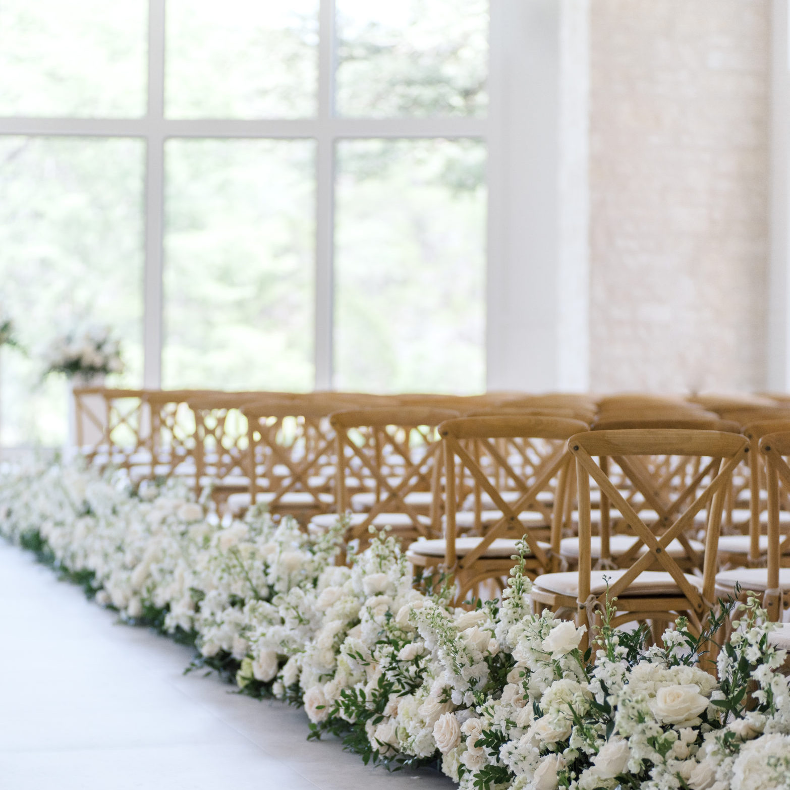 Wedding Chapel with wooden cross back chairs and large picture windows